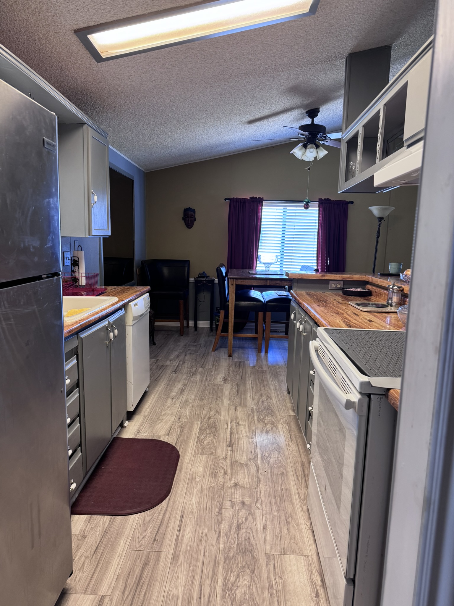 The kitchen — butcher-block counters and updated flooring