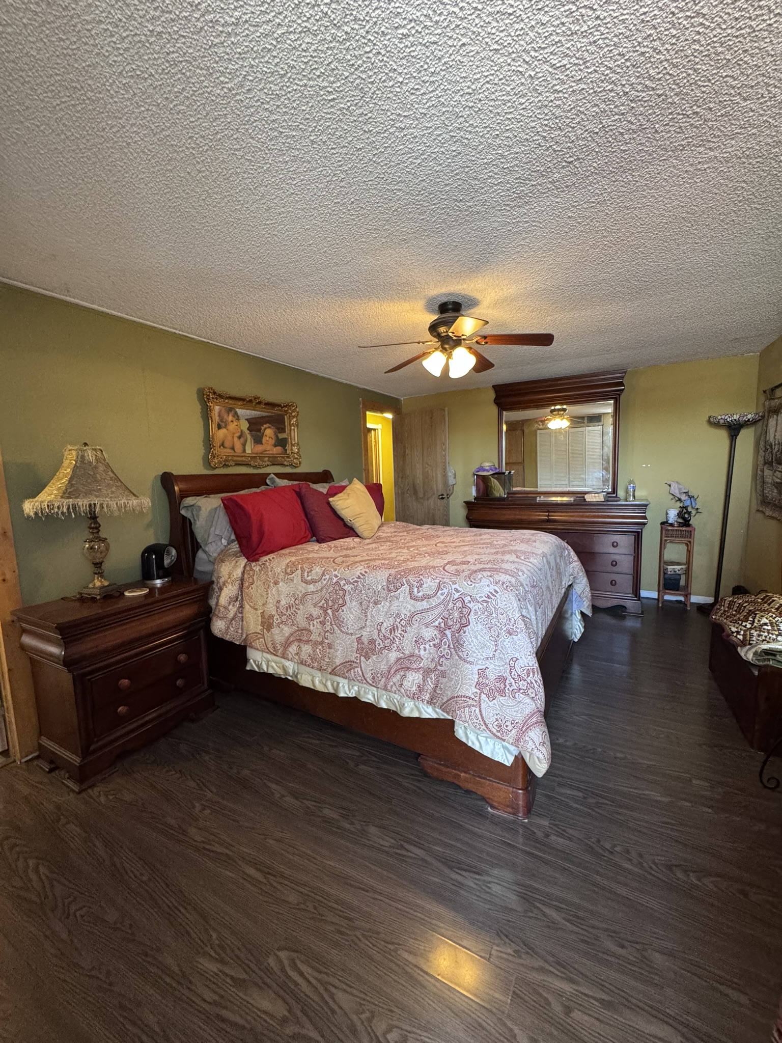 The primary bedroom — spacious, with room for a full furniture suite